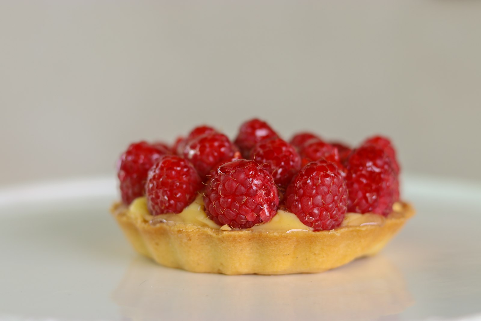 Raspberry tart with fresh berries