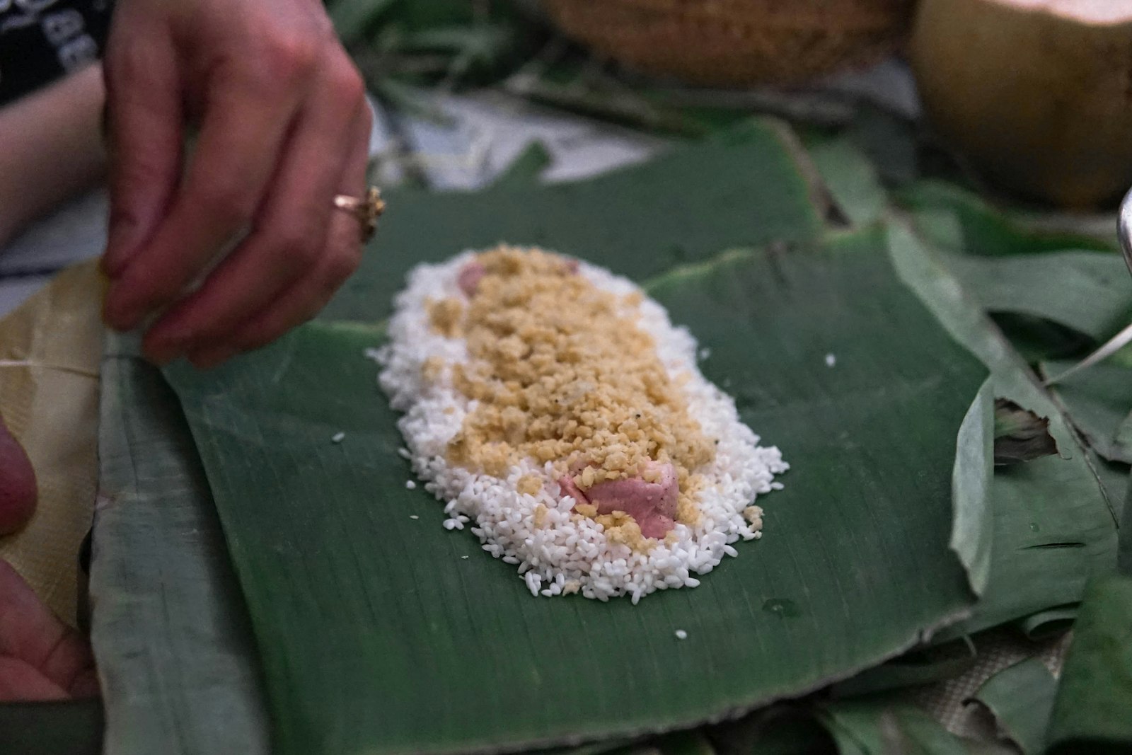 Sweet sticky rice with coconut on a banana leaf