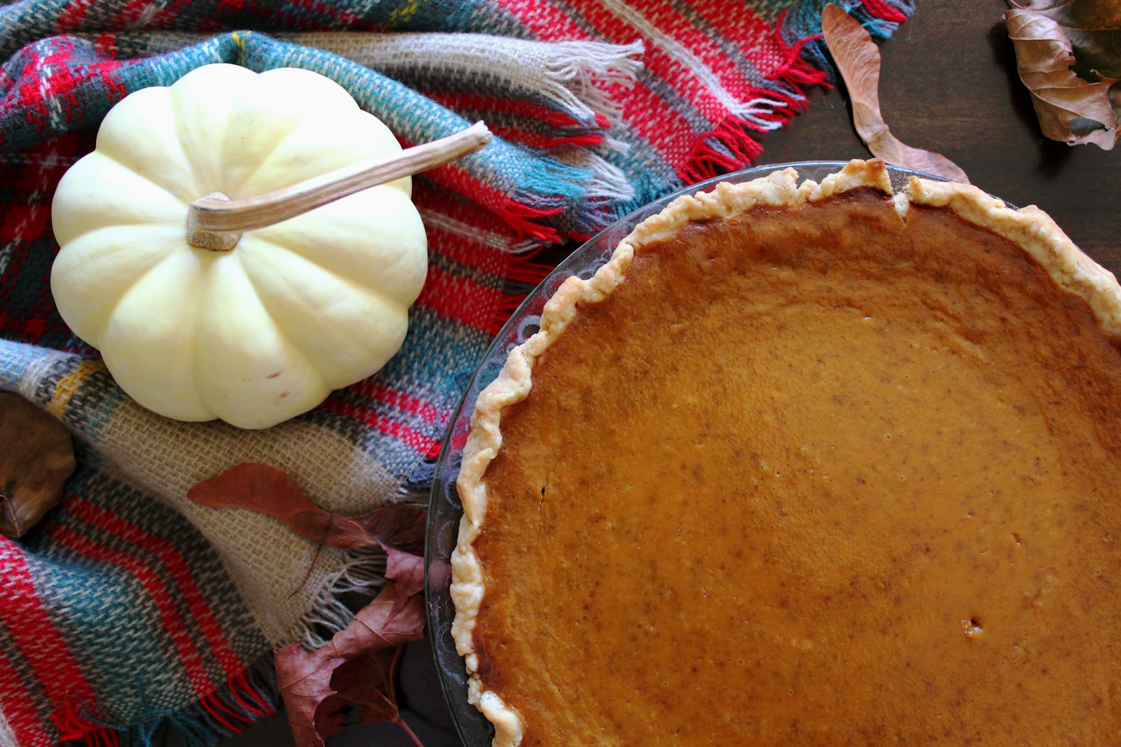 Whole sweet potato pie with mini pumpkins