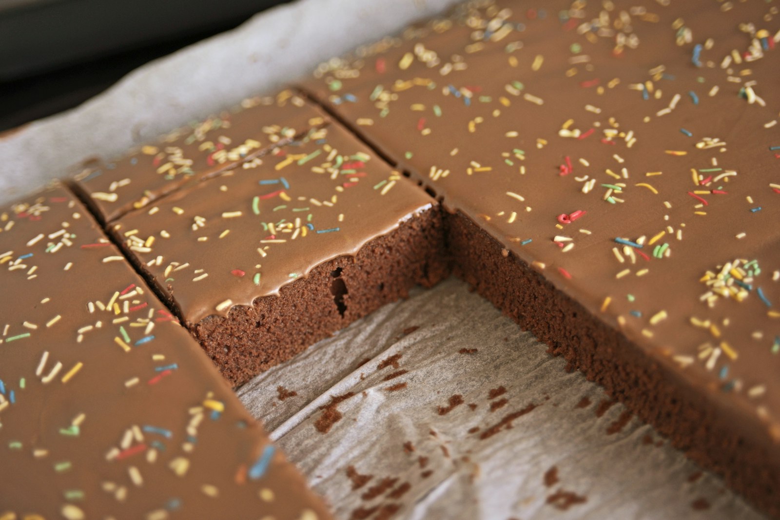 Texas sheet cake squares with glossy chocolate icing