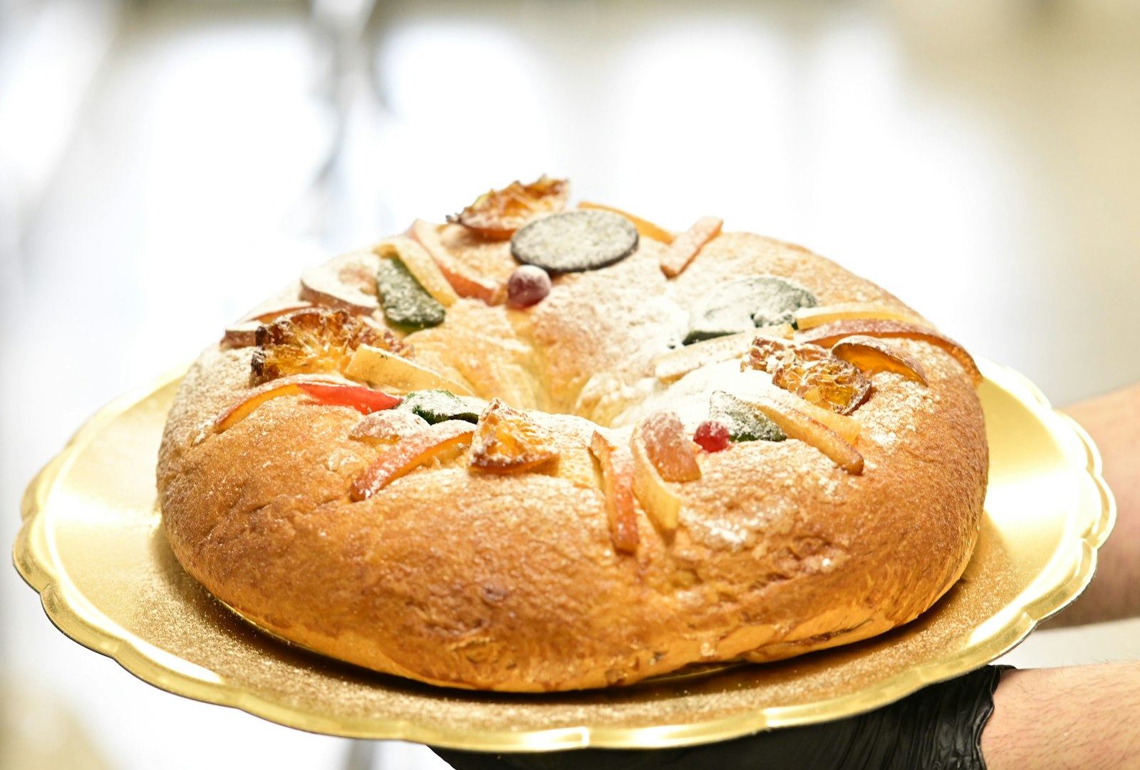 Ring shaped kings cake decorated with candied fruit