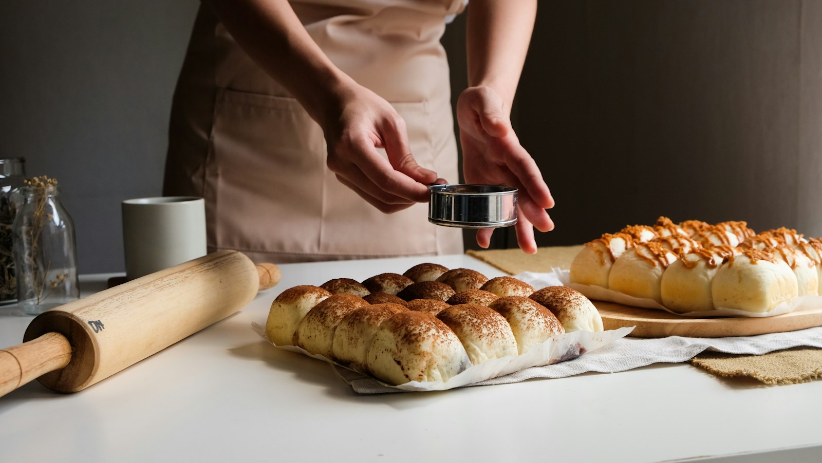 Baker shaping sweet honey buns