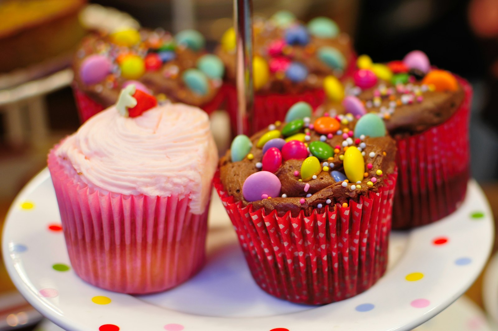 Cupcakes topped with candy and sprinkles