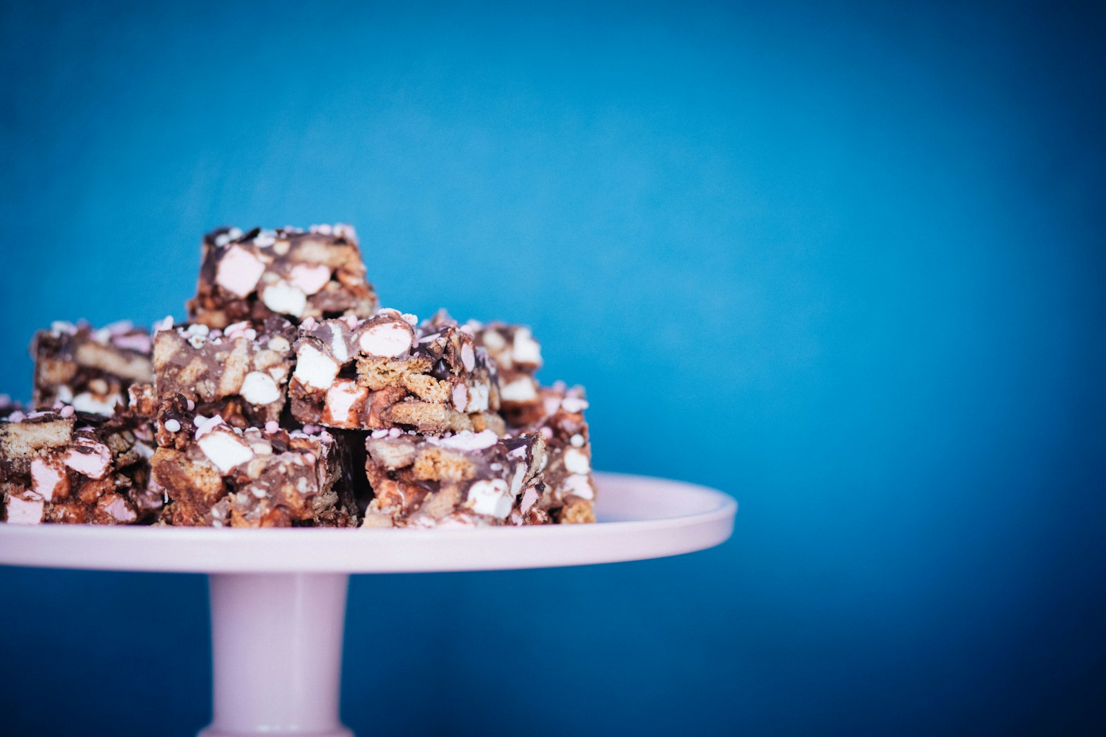 Rocky road squares on a cake stand