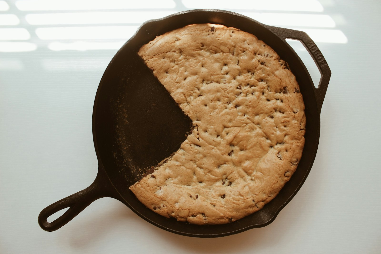 Giant skillet cookie with a slice missing
