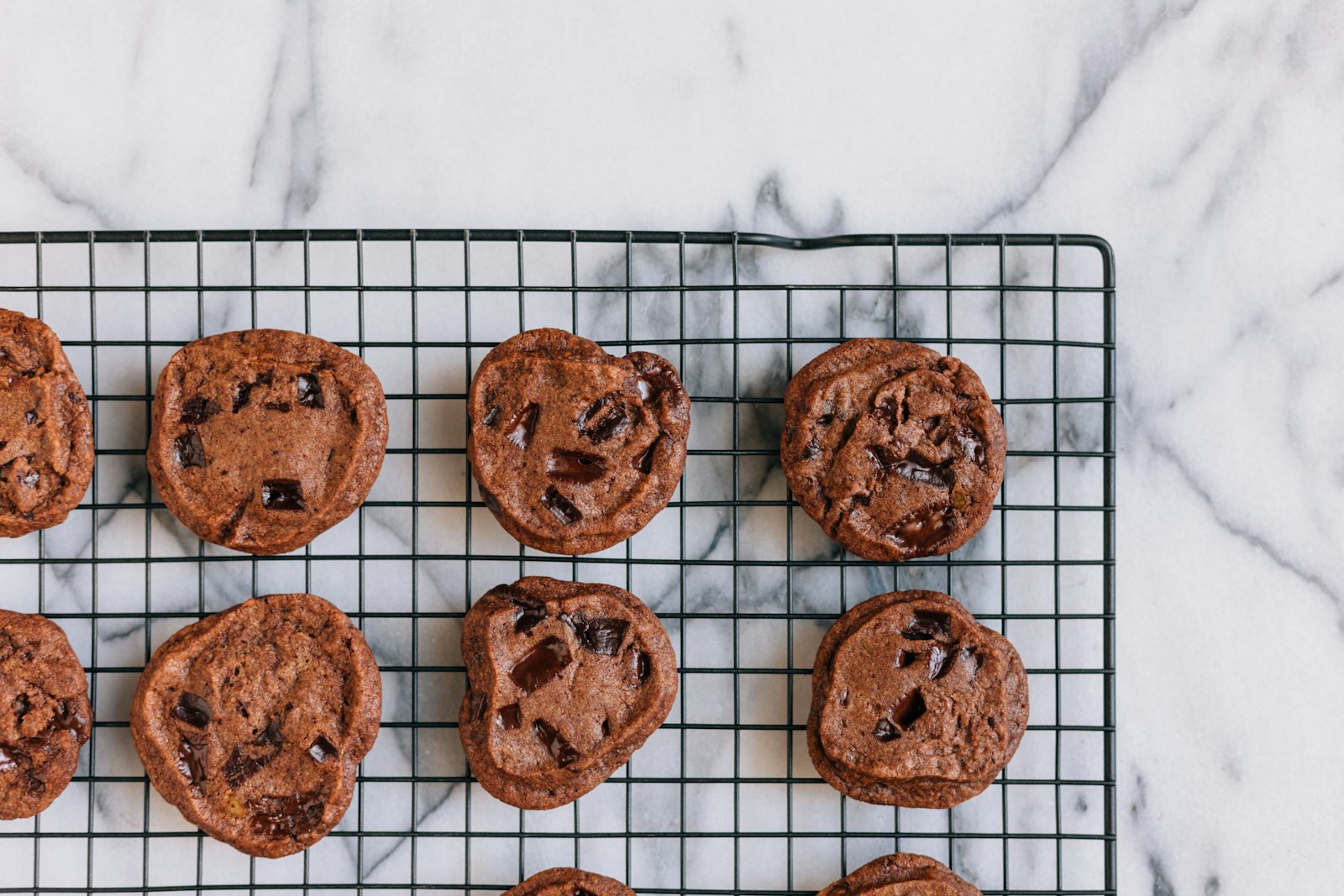 Soft chocolate chip cookies on a cooling rack