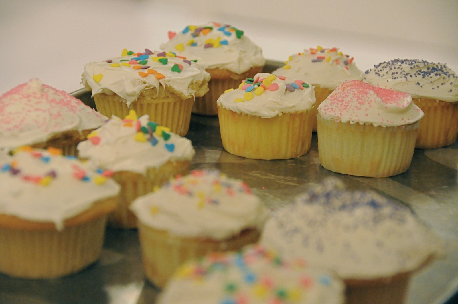 Vanilla cupcakes with pastel frosting