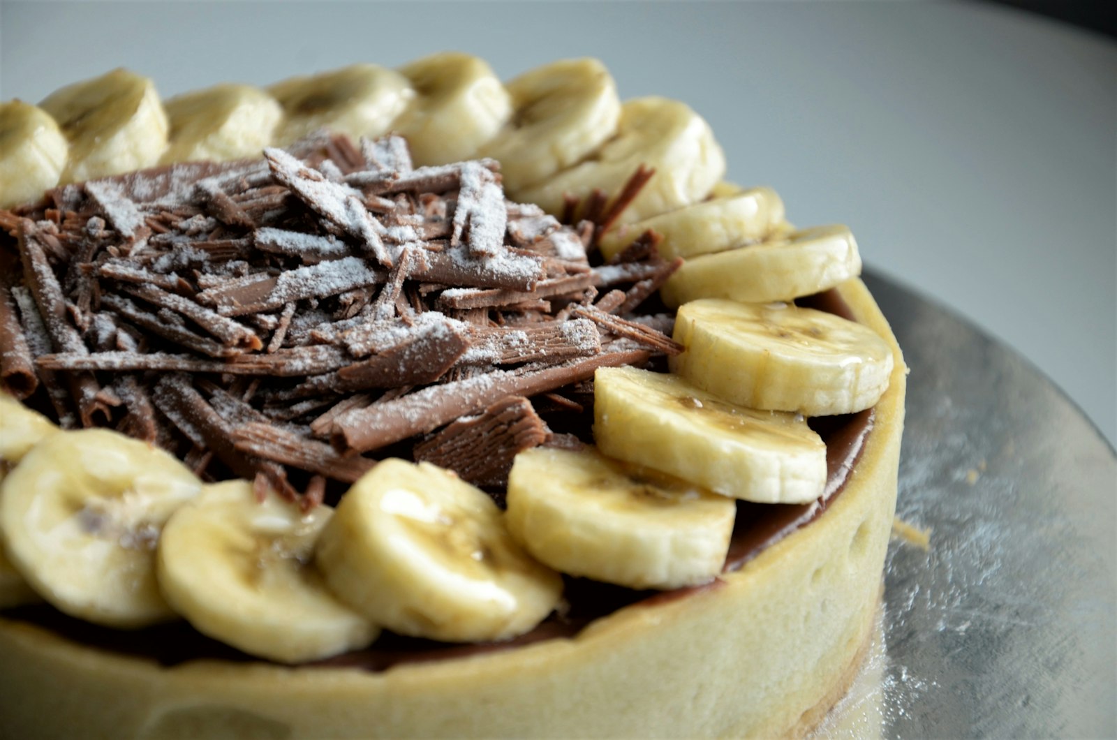 Banoffee pie with chocolate curls, a favorite among banana desserts