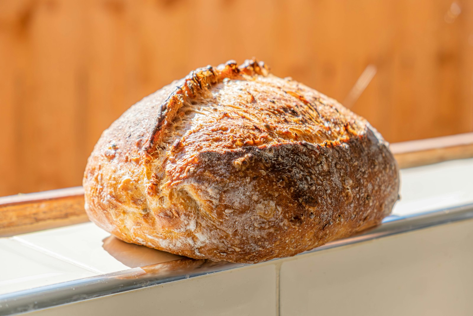 Crusty round boule with a golden scored top