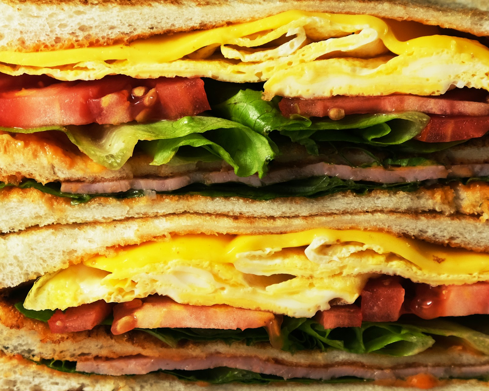 Breakfast club stacked with egg, bacon and lettuce
