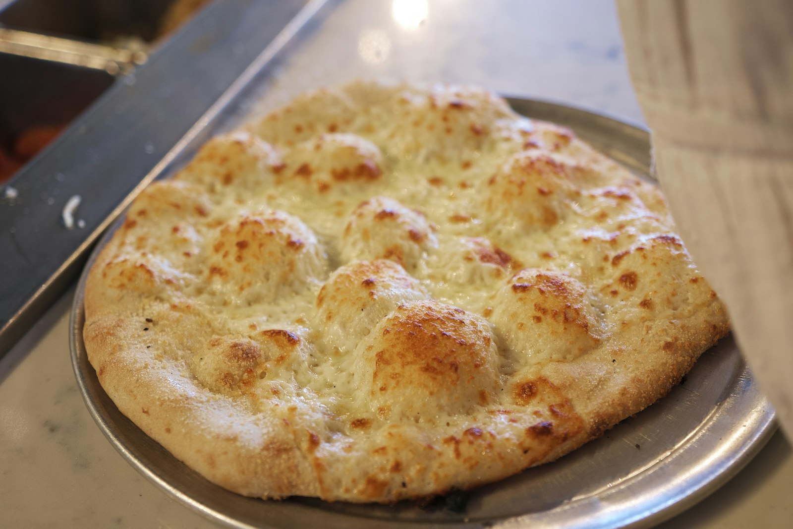 Golden bubbly flatbread baked with garlic butter
