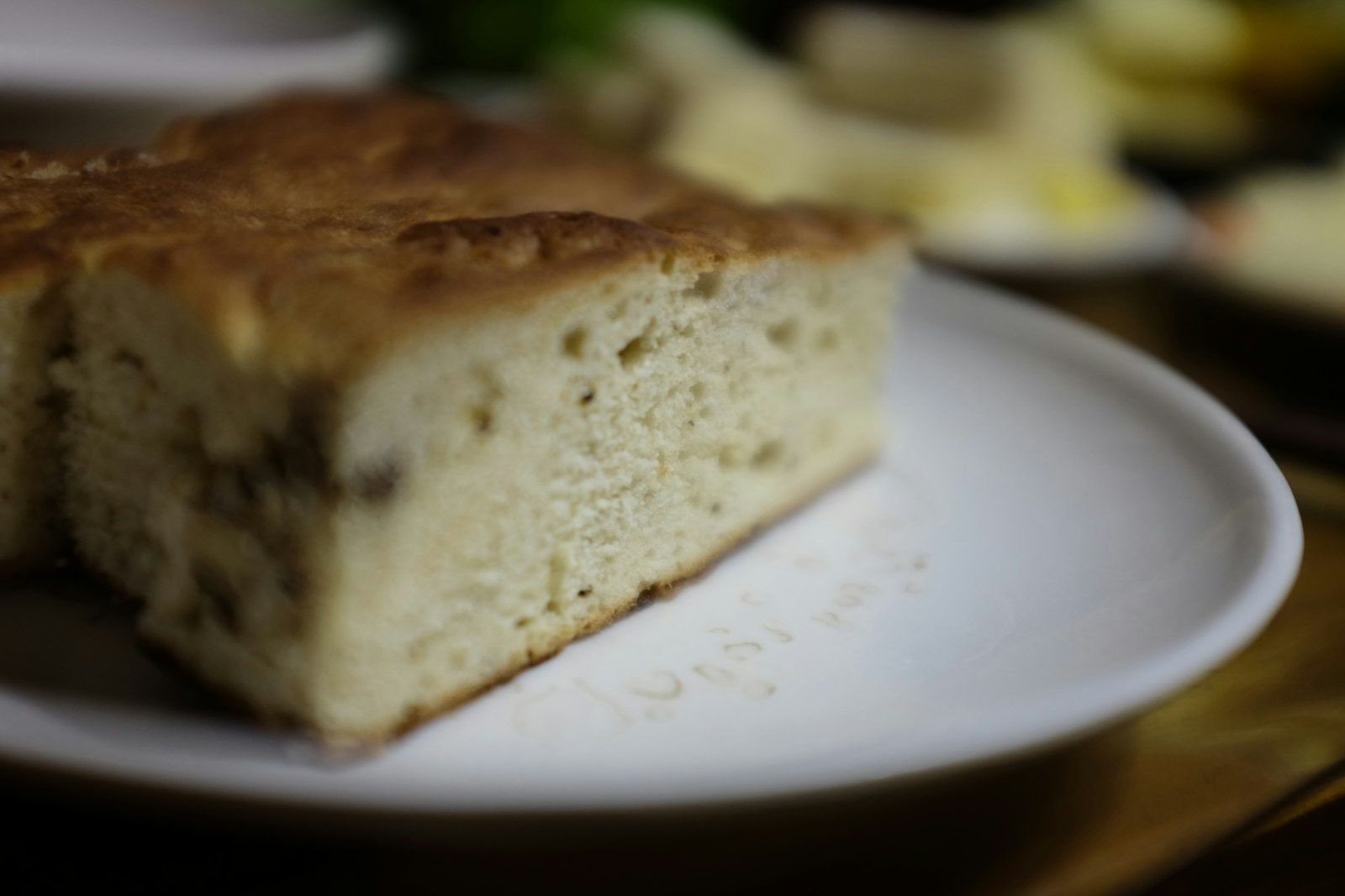 Thick slice of focaccia on a white plate