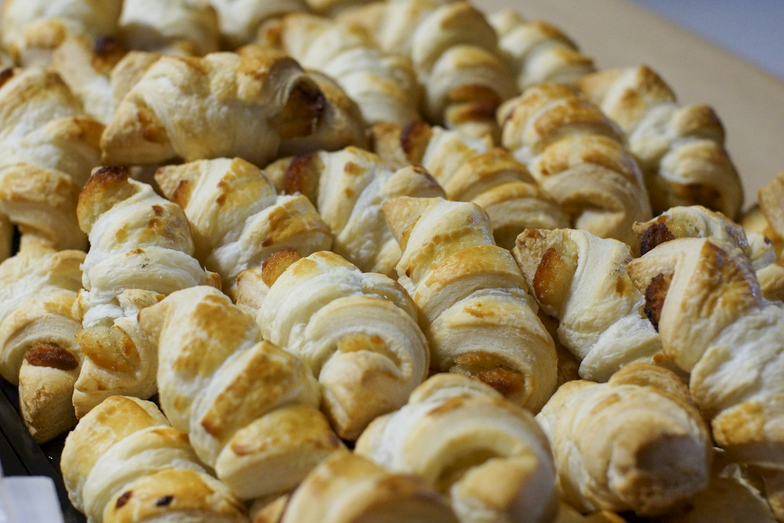 Flaky puff pastry twists piled together
