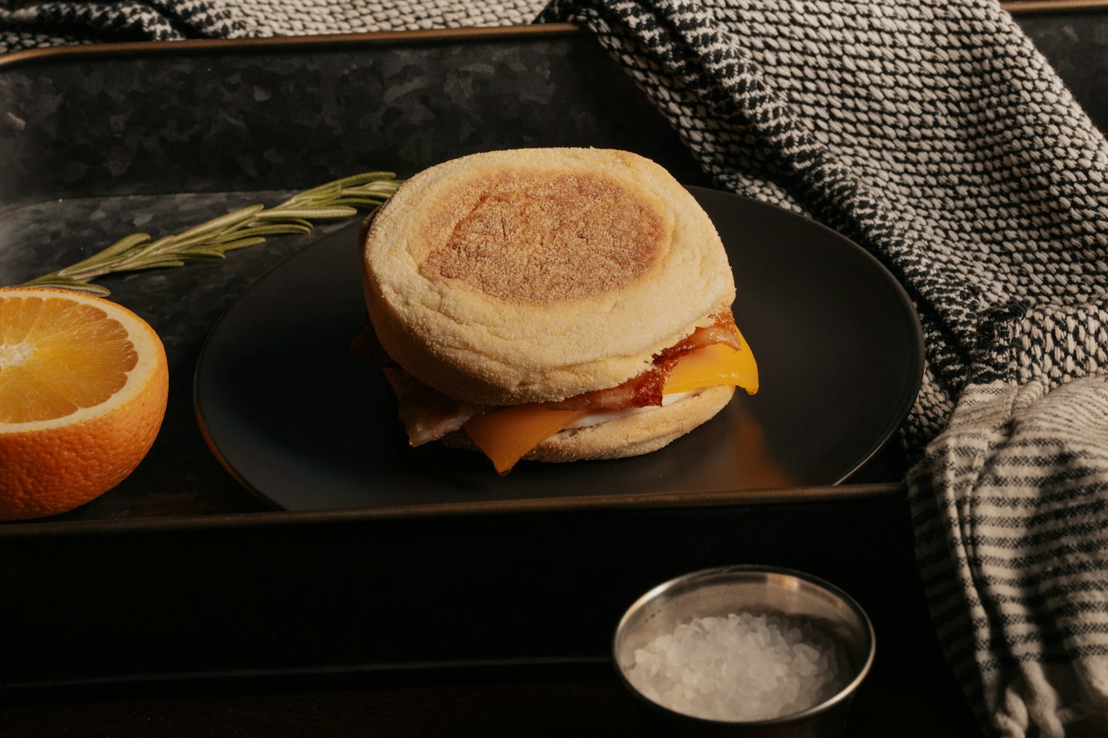 Homemade egg muffin sandwich with bacon and cheese