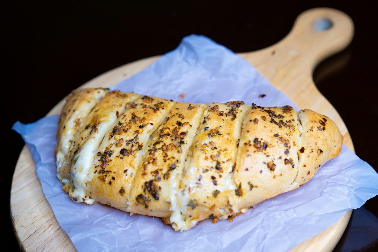 Herb topped stuffed loaf with slits on top