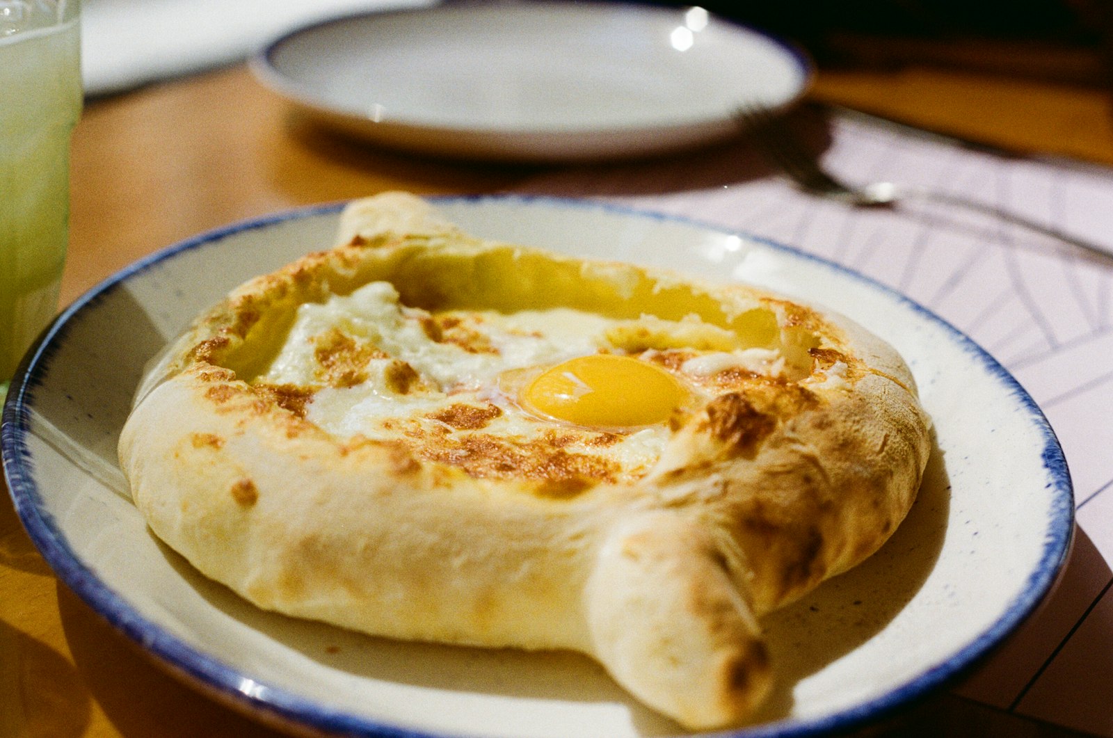 Georgian boat with melted filling and a runny egg yolk