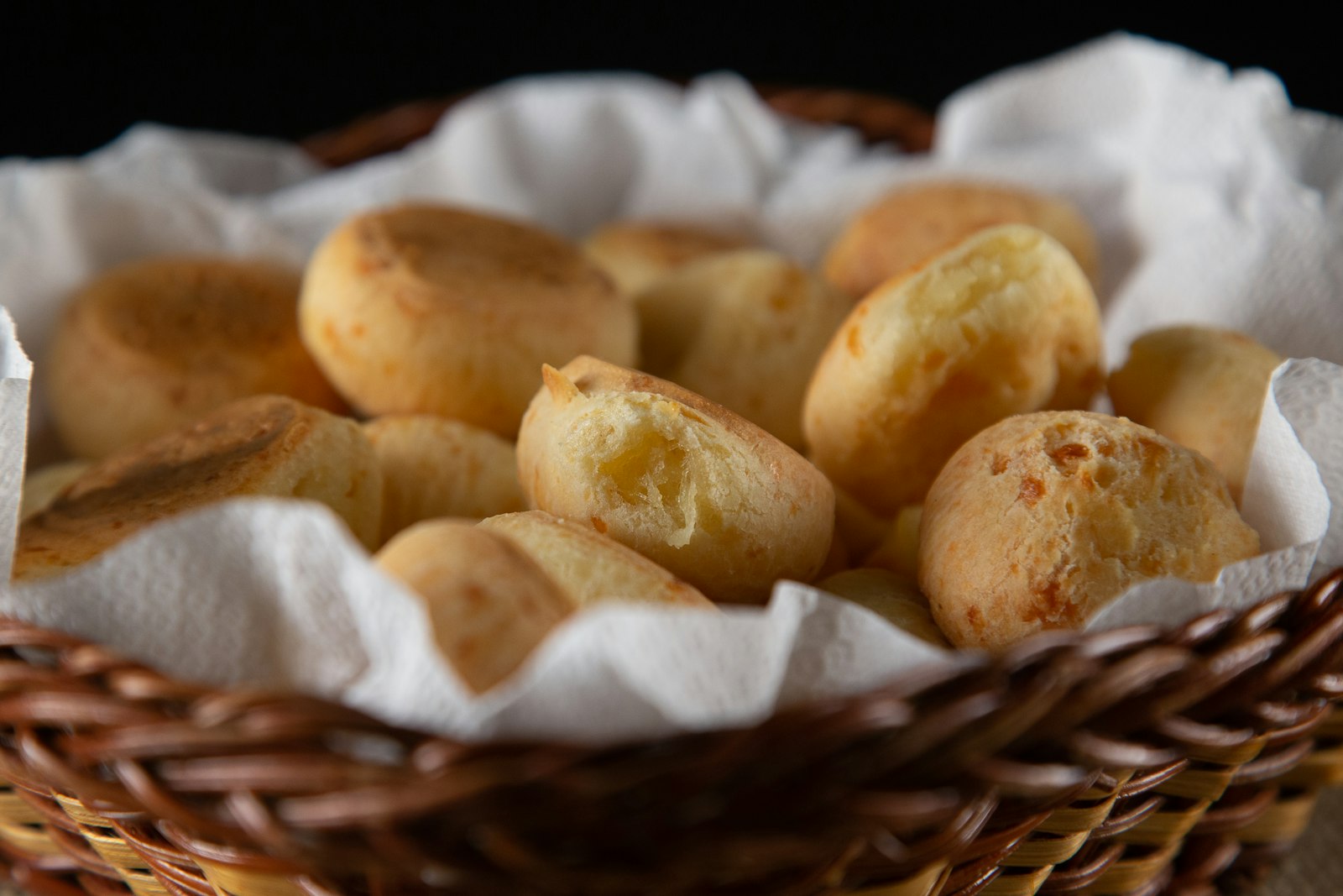 Basket of Brazilian pao de queijo cheese bread balls