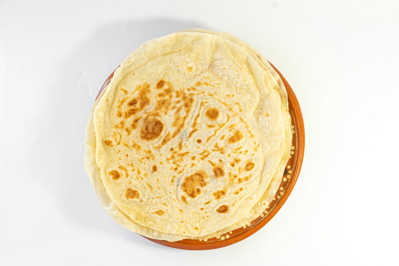 Golden piadina Italian flatbread on a plate