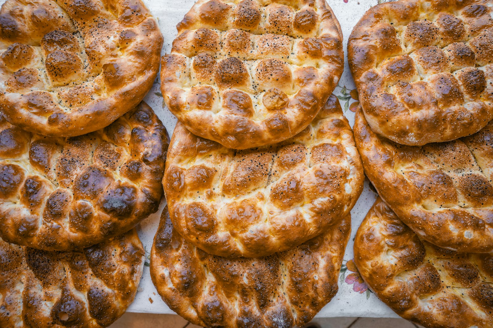 Turkish pide bread with sesame seeds on a tray