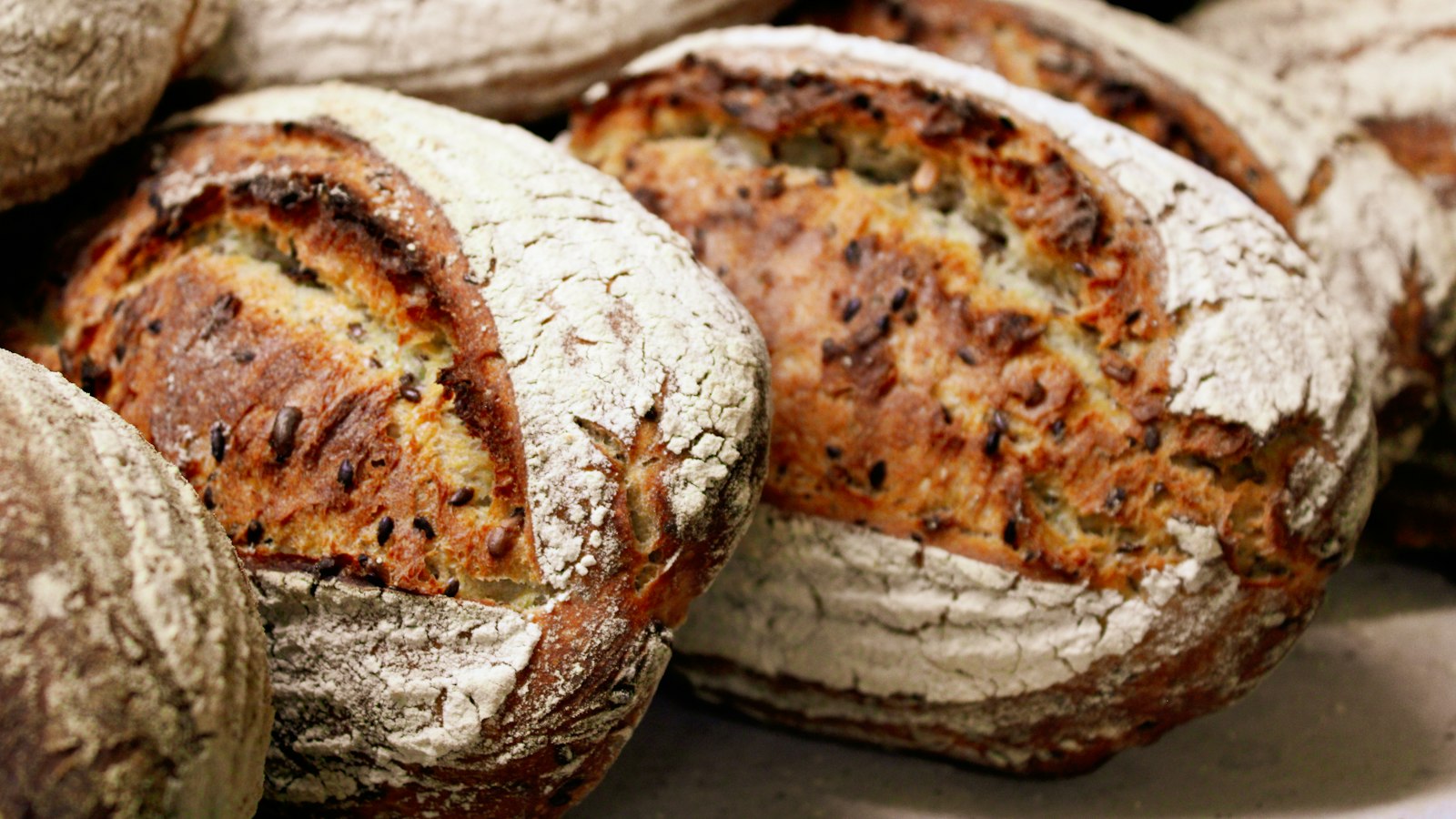 Seeded sourdough recipes loaves cut open