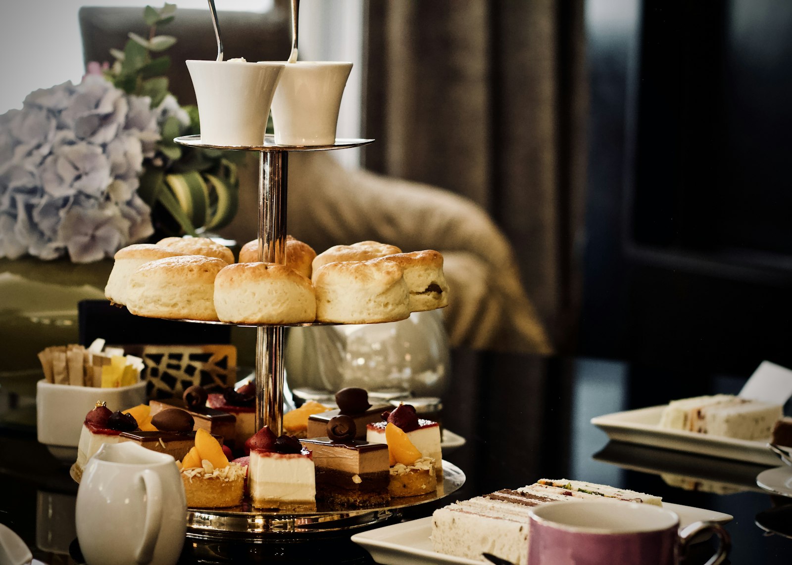 Afternoon tea stand with small cakes and treats