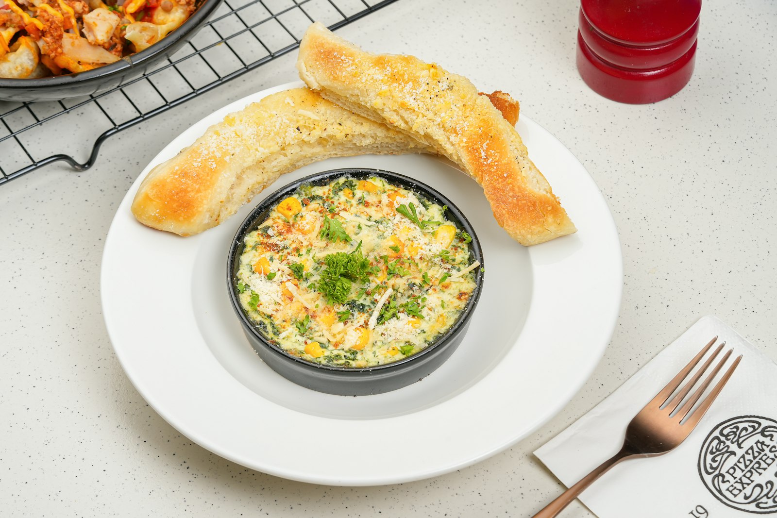 Hot crab dip in a ramekin with toast