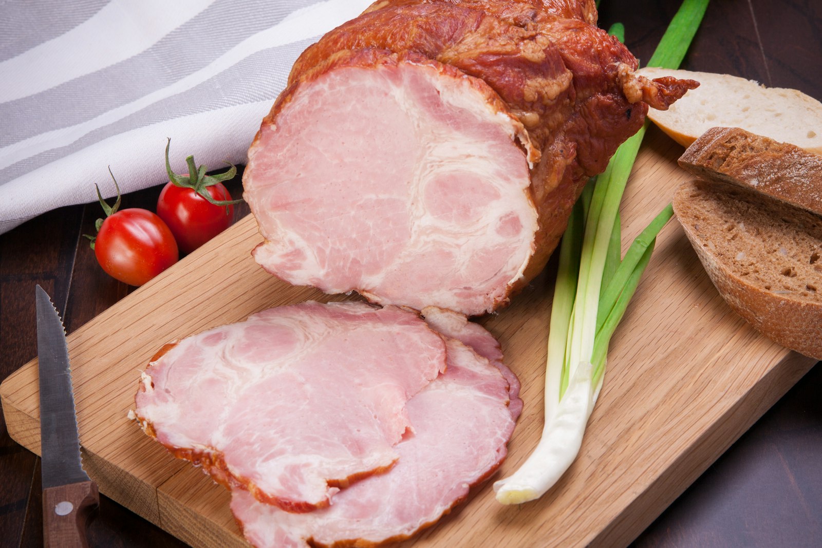 Christmas Eve dinner ham sliced on a cutting board