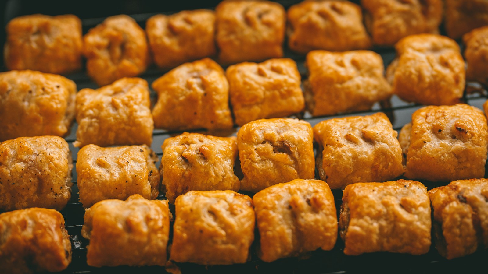 Retro appetizers: pigs in a blanket in rows