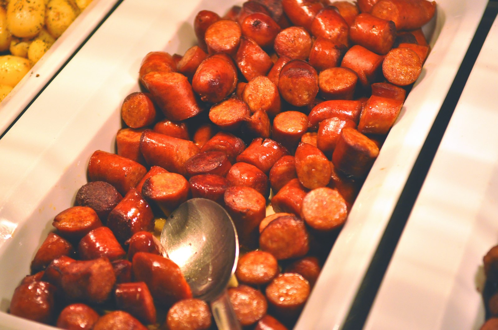 Cocktail sausages in sauce, retro appetizers for a buffet
