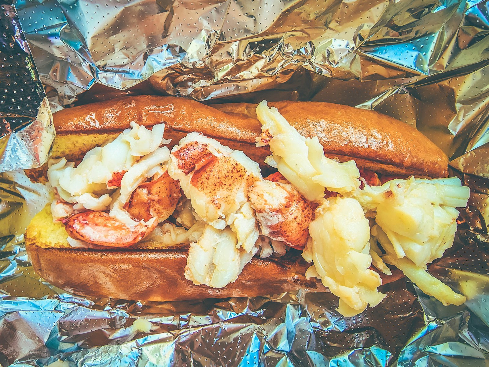 lobster, corn and sausage cooked together in foil