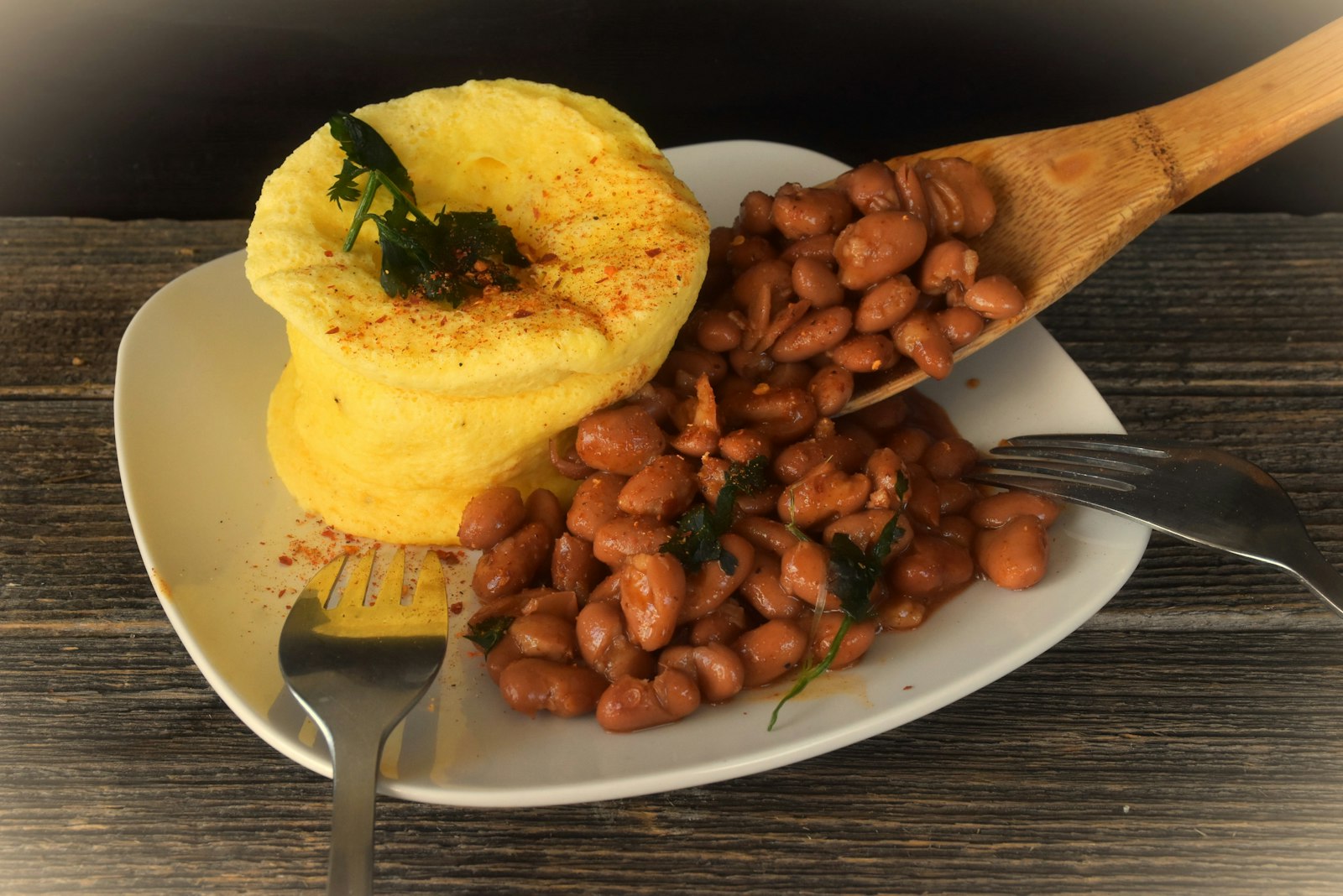 New England baked beans with cornbread on a plate