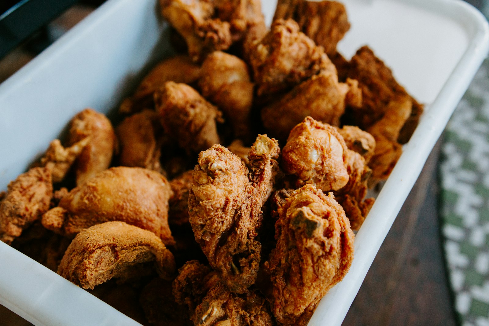 pieces of oven baked crispy chicken in a white dish