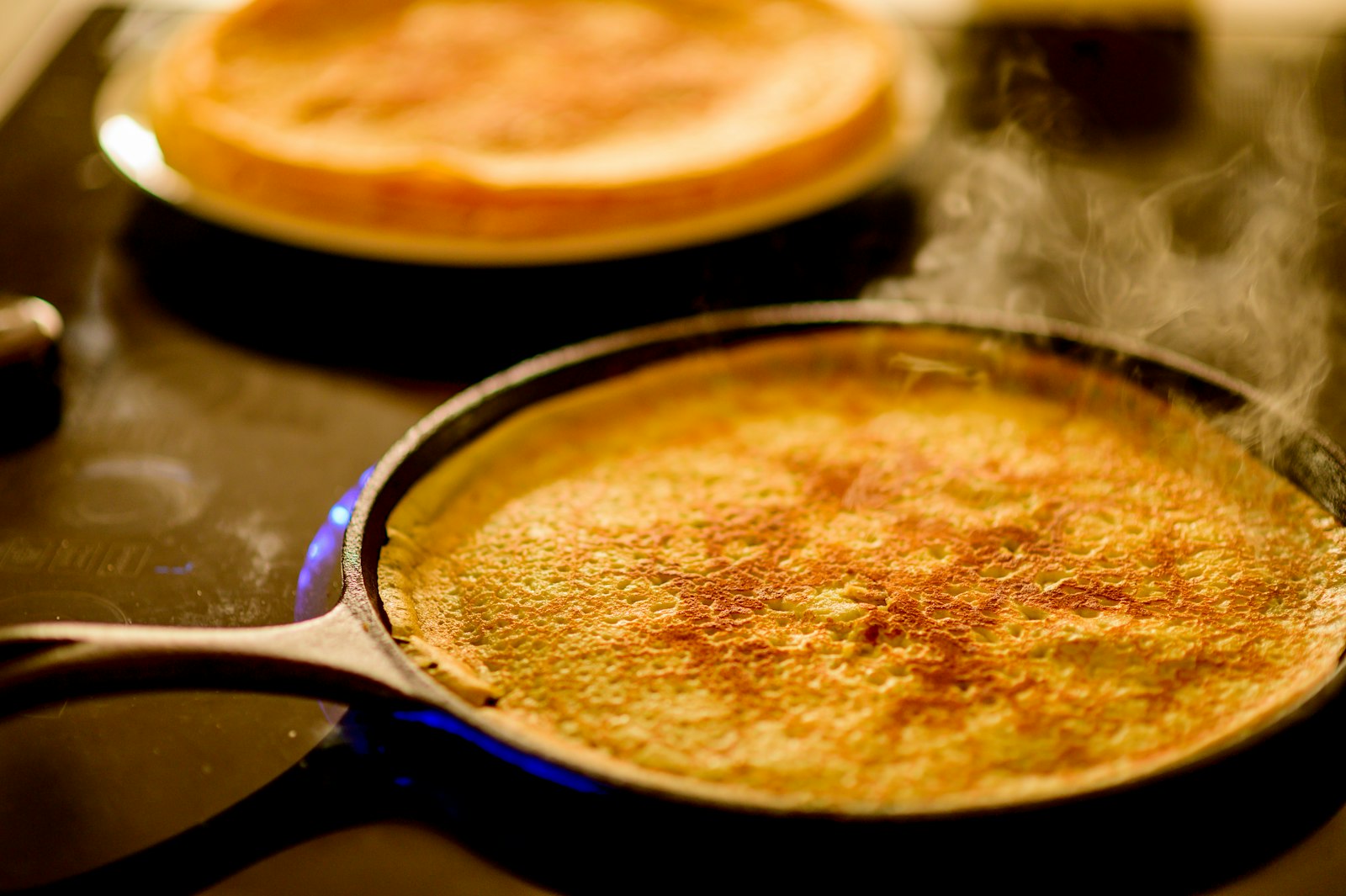 golden skillet cornbread in a cast iron pan