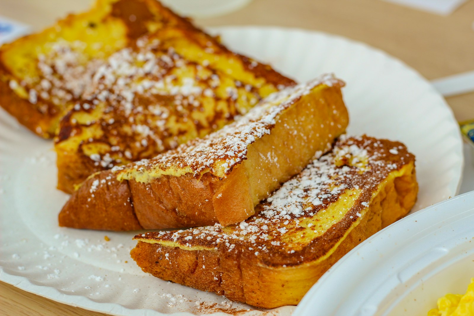 Thick slices of French toast with powdered sugar