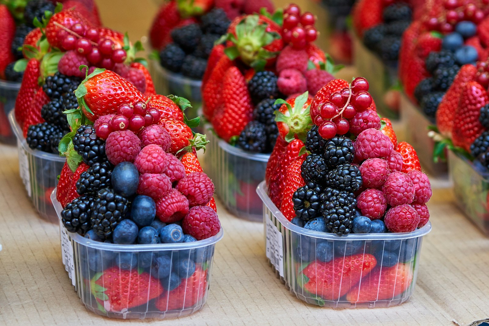 Cups of fresh mixed berries, one of our favorite low sugar desserts