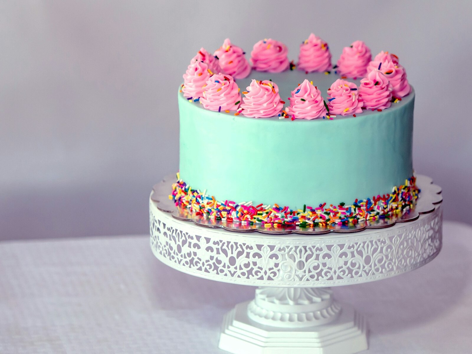 Funfetti cake with sprinkles and pink frosting