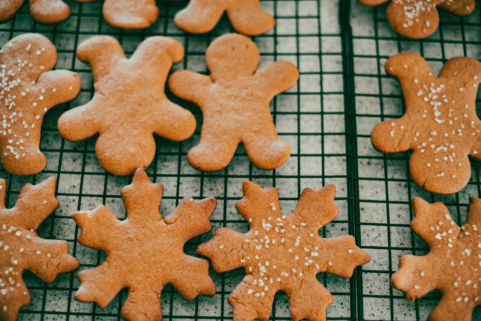 Gingerbread men cookies on a cooling rack