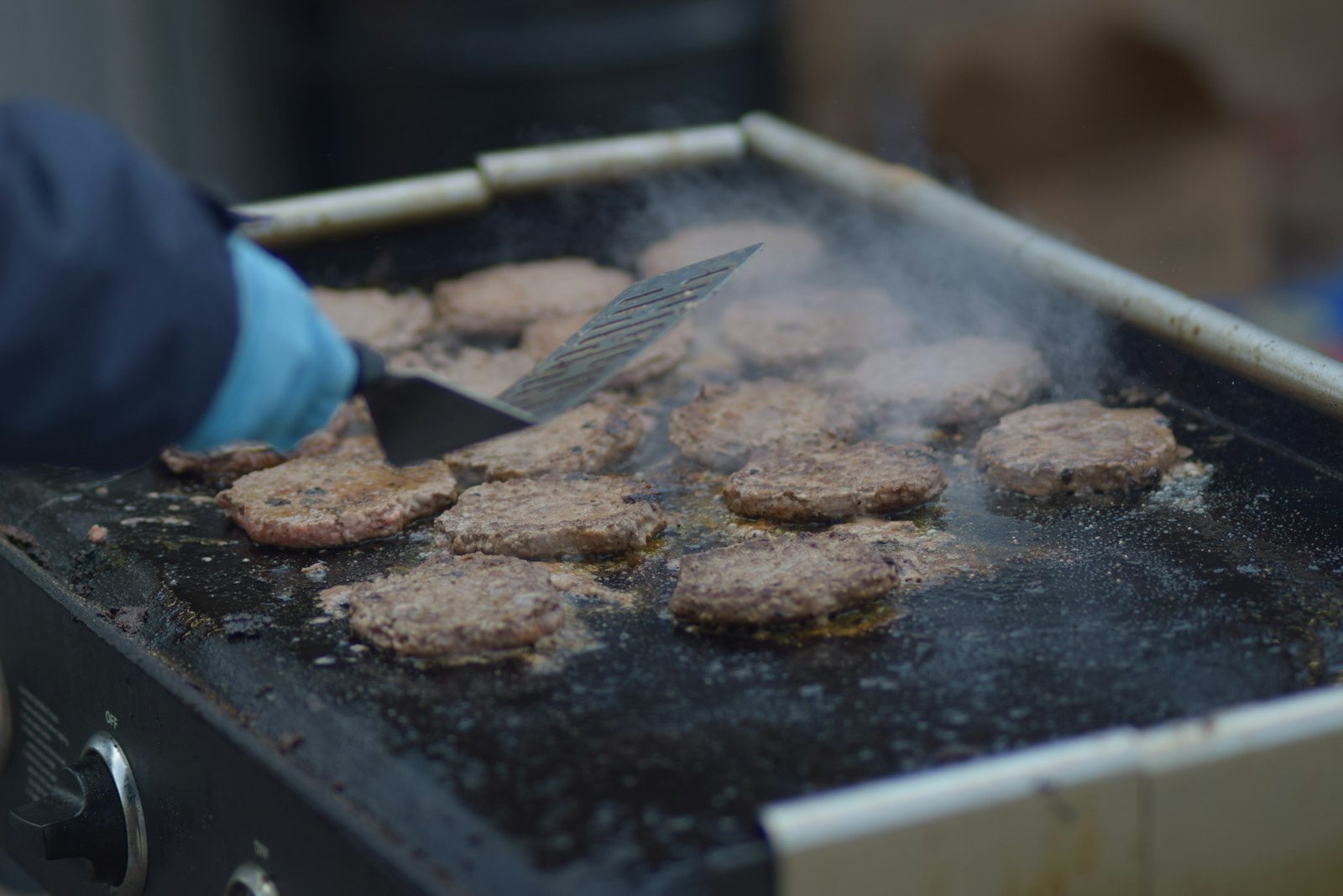 Burger patties on a hot griddle
