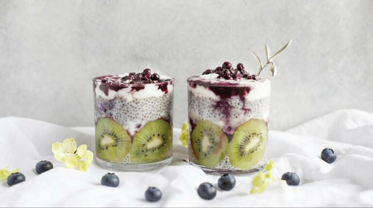 Healthy desserts: kiwi chia pudding with yogurt and blueberry compote