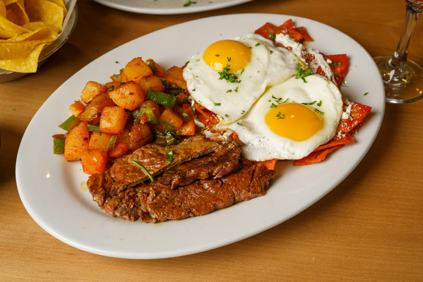 Huevos rancheros with fried eggs and potatoes