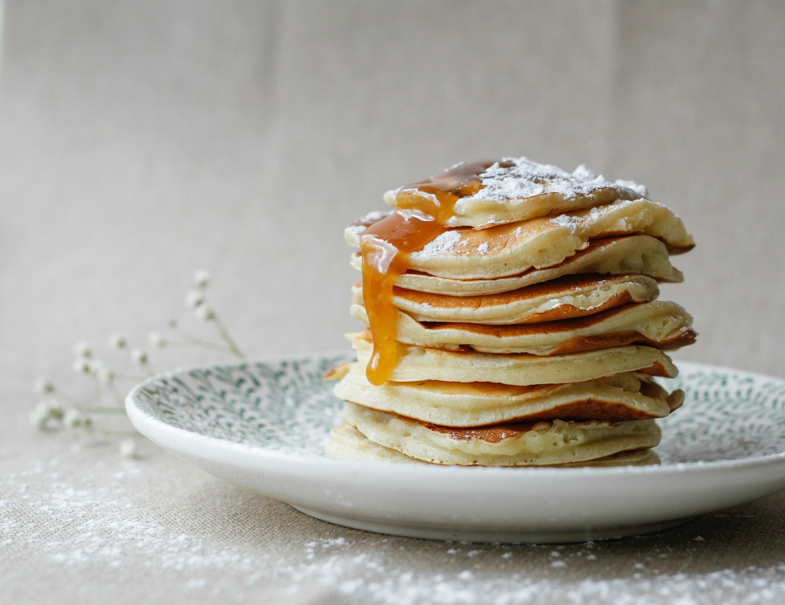 Small stack of pancakes with honey drizzle
