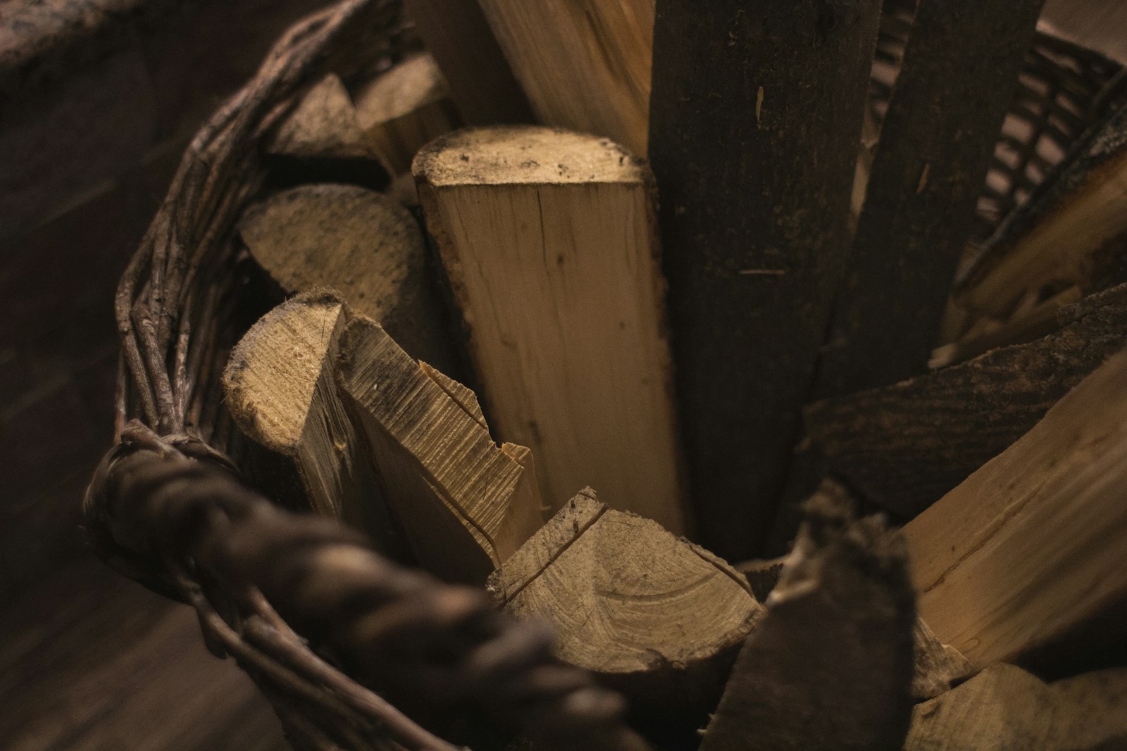 Cut wood logs stacked in a woven hamper