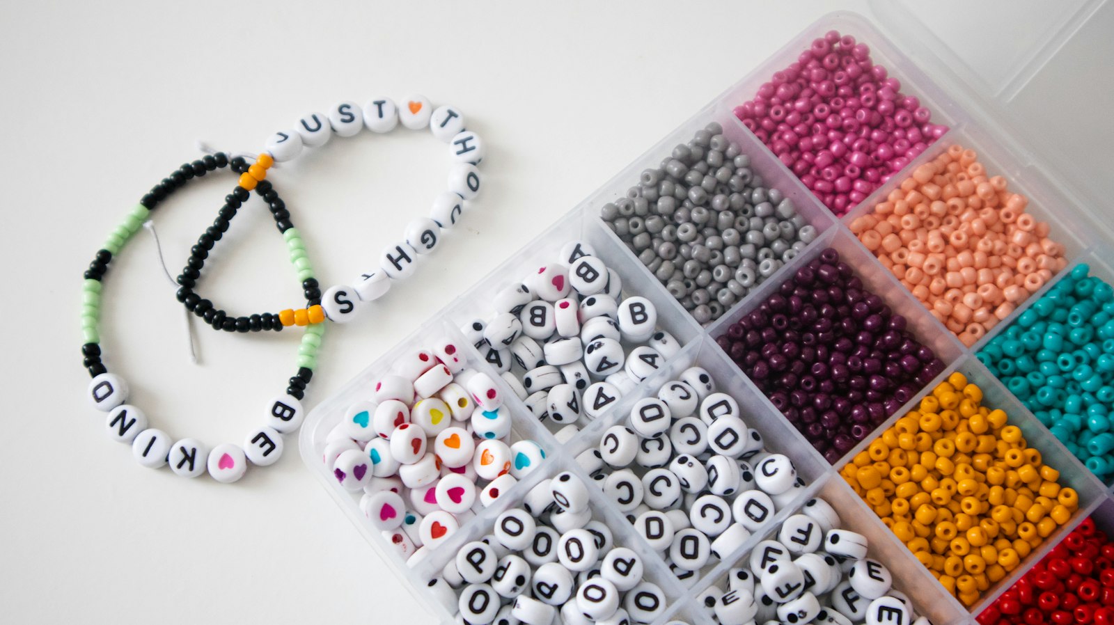 Box filled with lots of different colored beads