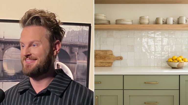 Bobby Berk style portrait beside a sage green kitchen with brass pulls and a white tile backsplash