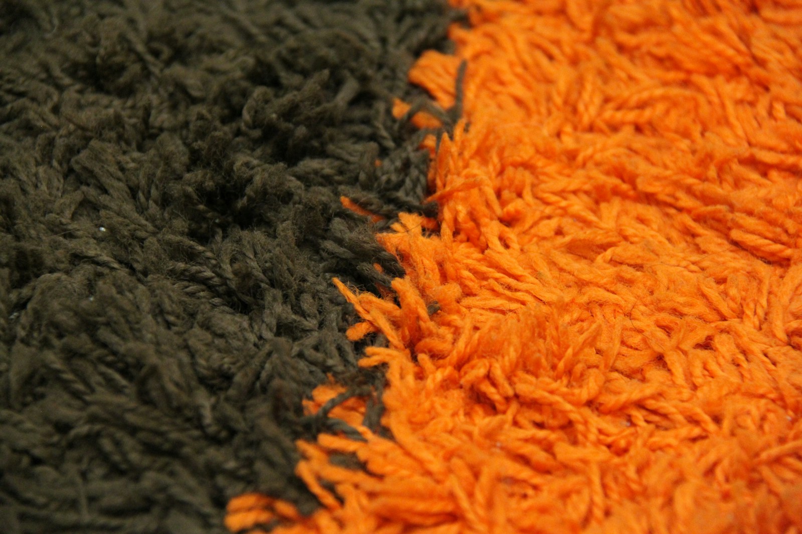 Brady Bunch house style: a brown and orange shag rug up close