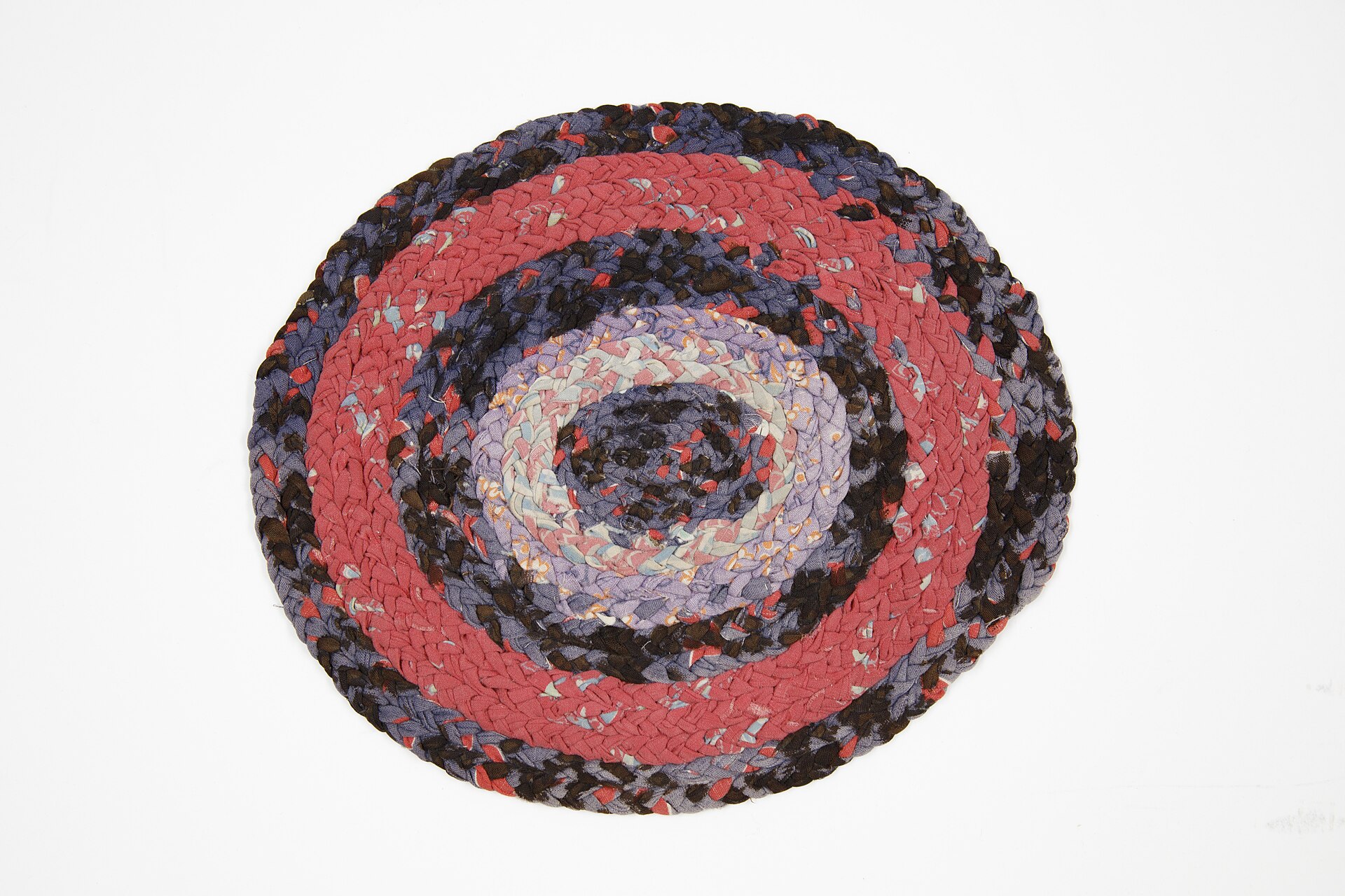 Round braided rag rug made from fabric strips