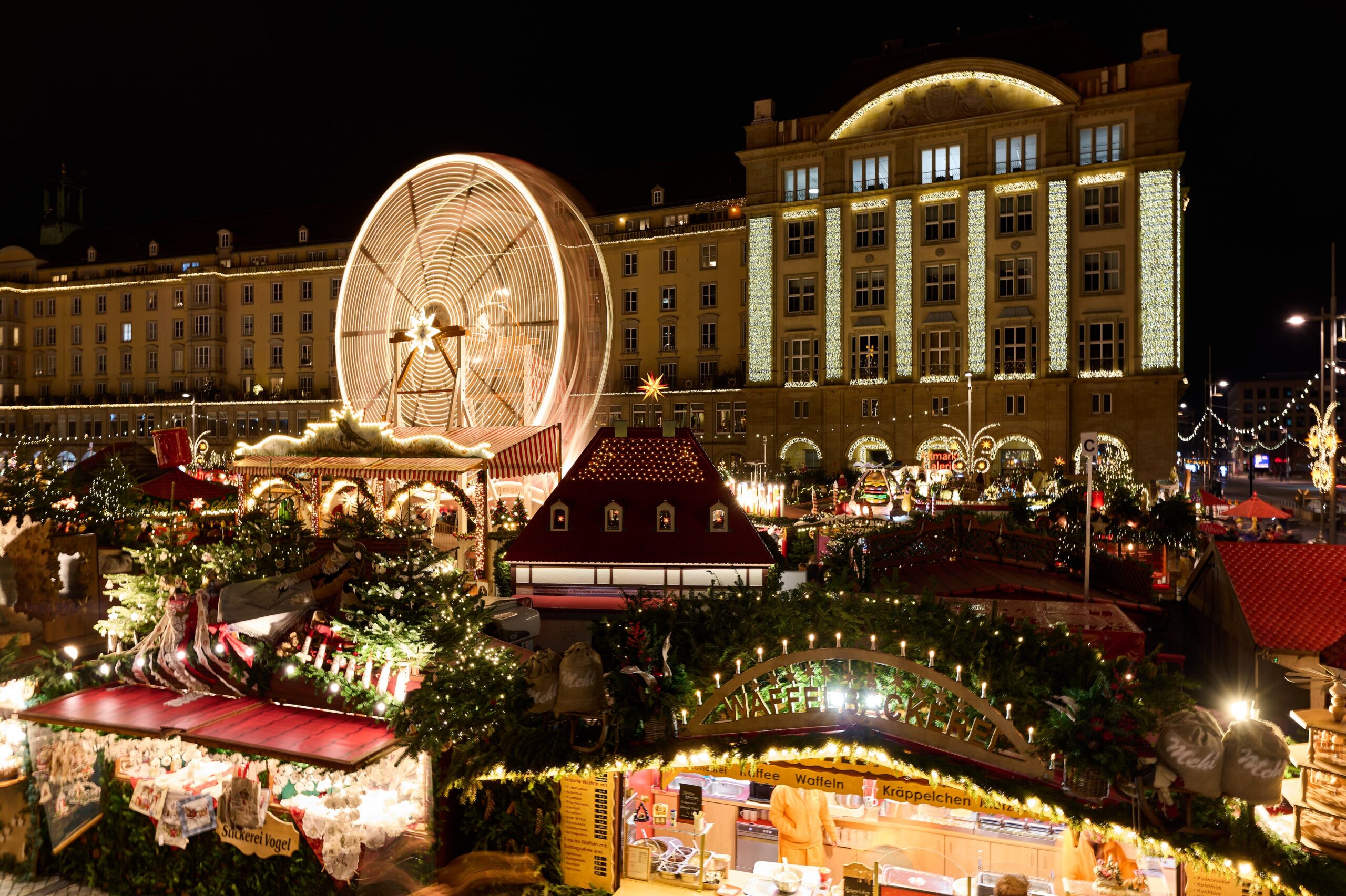 Dresden Christmas market at night with a giant wooden pyramid