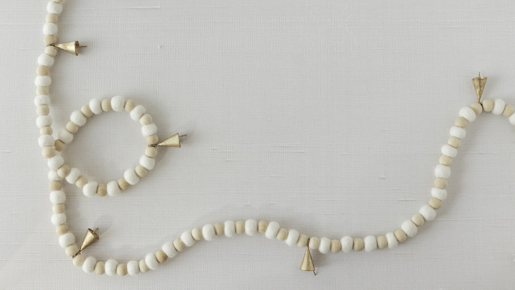 Wooden bead garland with small golden bells
