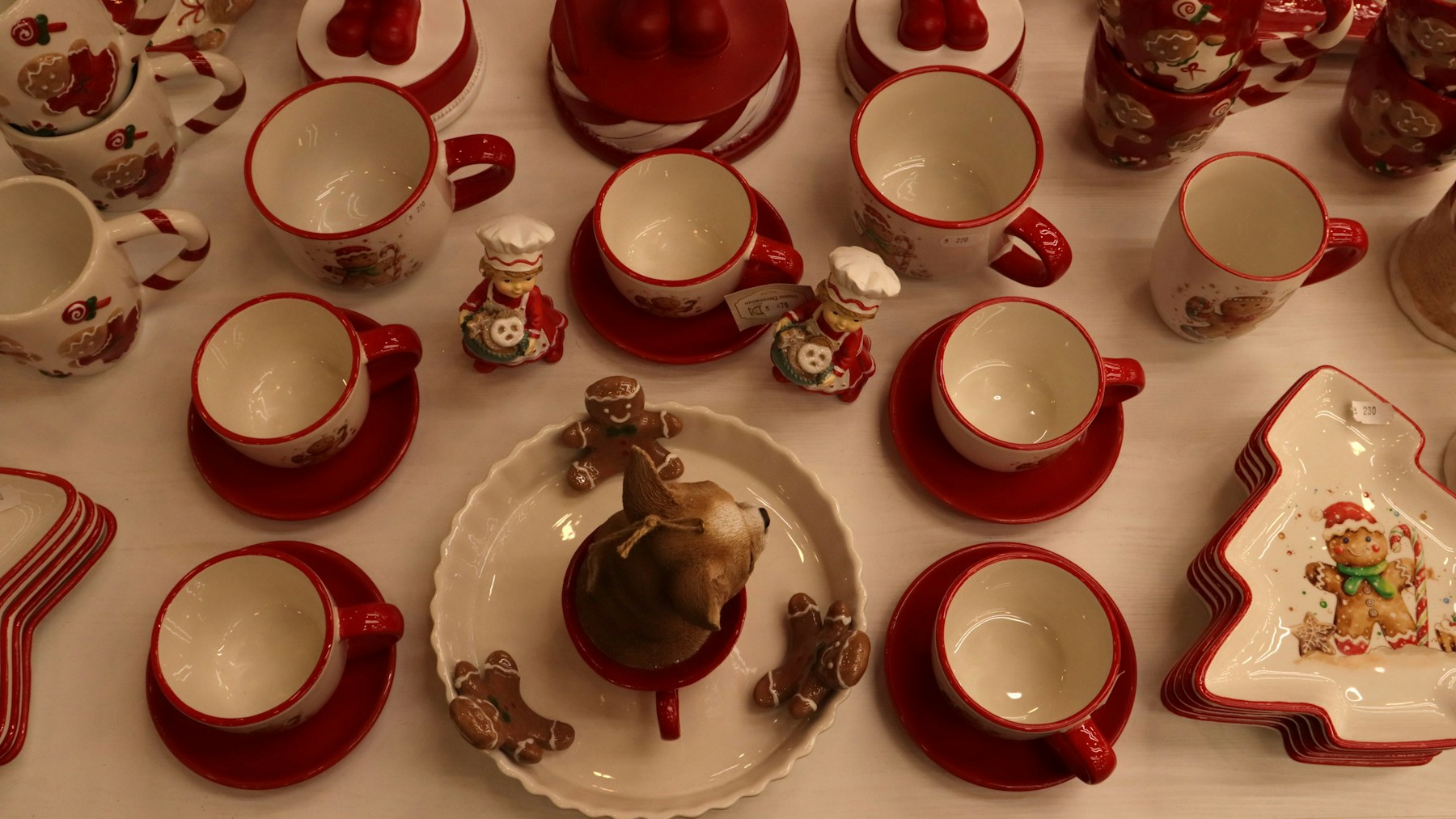 Christmas kitchen decor with red and white holiday mugs and dishes