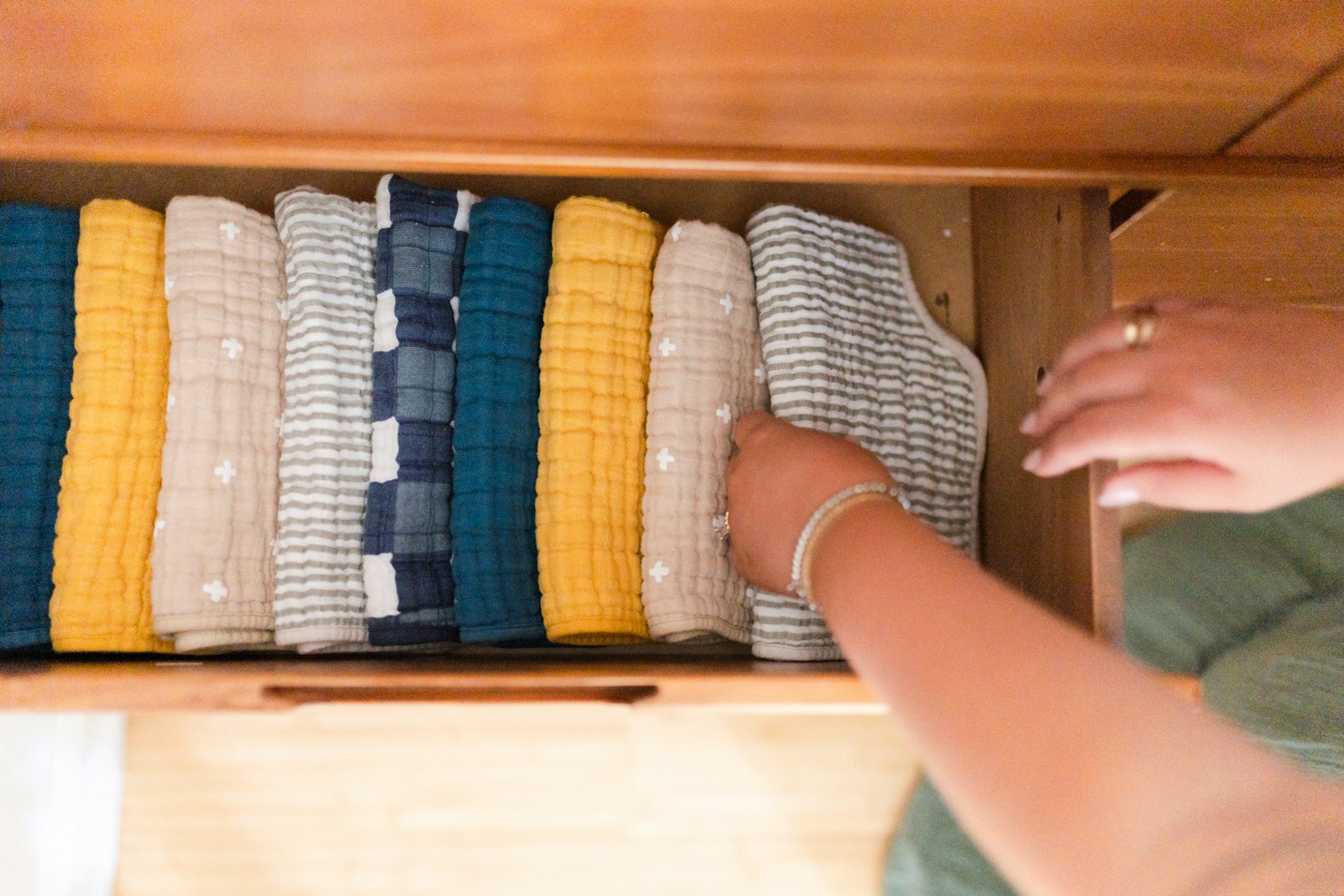 Clothes folded upright in a drawer so every piece shows